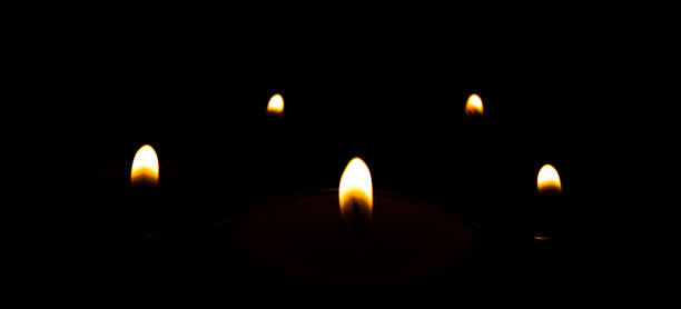 istock Candle flames isolated on black background. 1405100096