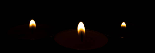 istock Candle flames isolated on black background. 1405100097