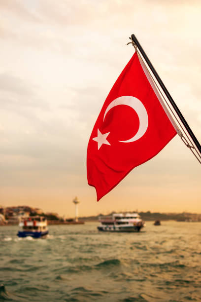 istock Turkish flag at sunset to Bosphorus, Istanbul 1405102733