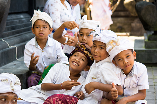 Bali, Indonesia. August 23, 2015: The group of unidentified Balinese kids is posing for the camera.