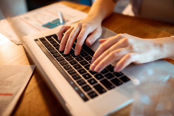 istock Woman using a Laptop at home 1405107744