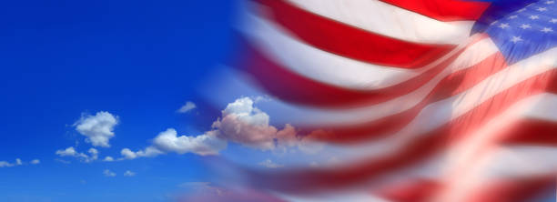 istock American flag blurred motion  over sunny blue sky 1405110749