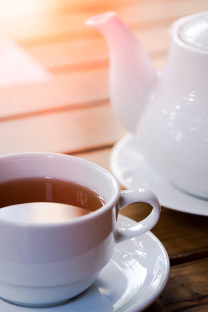 istock Cup of tea with teapot on wood table cafe 1405112745