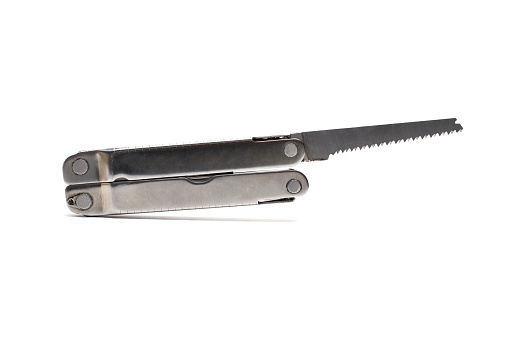 Close-up of an unfolded saw of a jackknife pocket knife on a white background with visible shadow