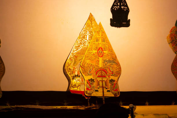 istock wayang kulit or shadow puppets from Java, Indonesia puppet show by dalang or puppeteer . Wayang made from leather 1405118155