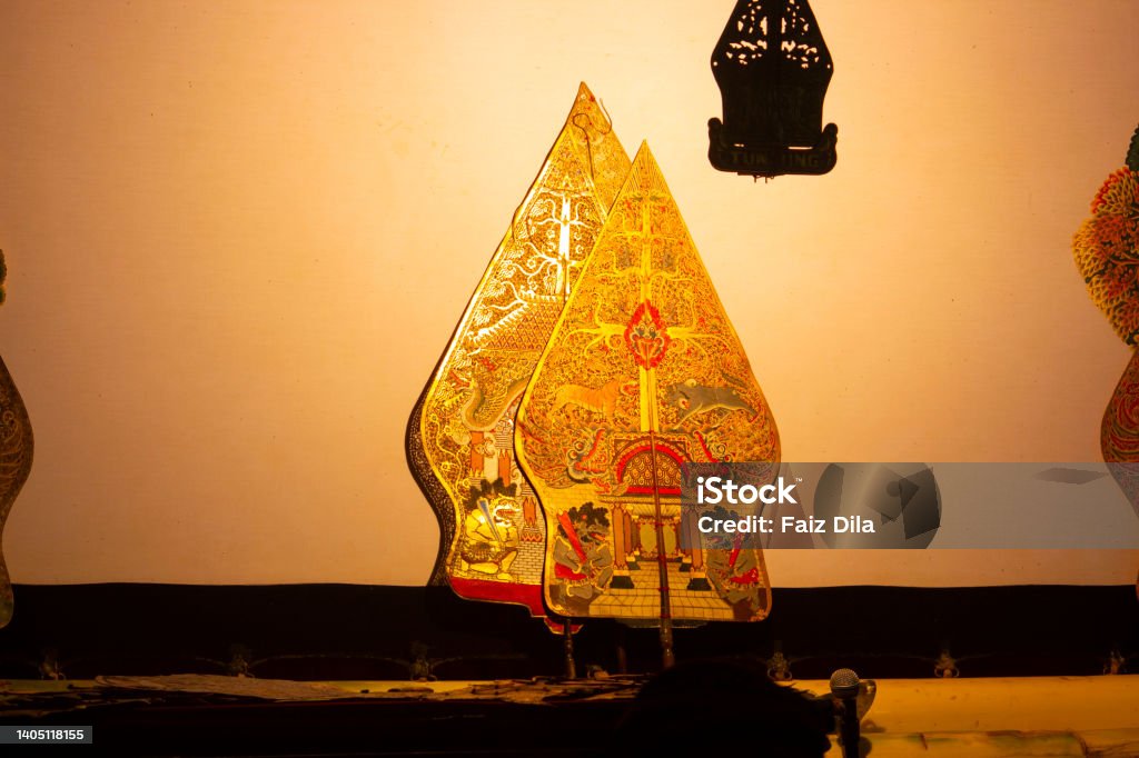 wayang kulit or shadow puppets from Java, Indonesia puppet show by dalang or puppeteer . Wayang made from leather Puppet Stock Photo