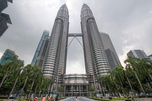 Kuala Lumpur, Malaysia - Jun 07, 2022: The landmark Petronas Twin Towers and KLCC Twin Towers in the city of Kuala Lumpur Malaysia. The towers are the tallest twin towers in the world.