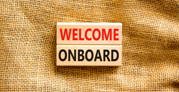 istock Welcome onboard symbol. Concept words Welcome onboard on wooden blocks on a beautiful canvas table canvas background. Business onboarding and welcome onboard concept, copy space. 1405123673