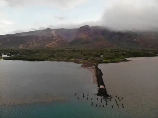Historic Harbor on Molokai in the morning with a light rain.