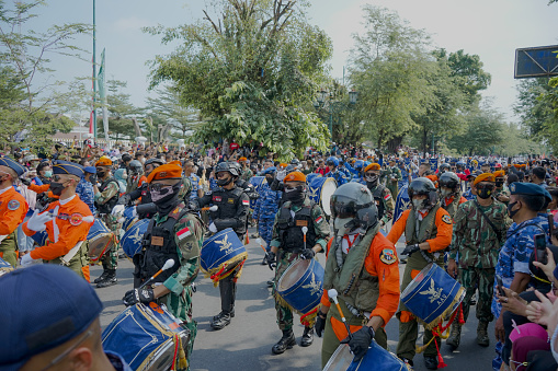 Indonesian Air Force marching band parade on Malioboro street Yogyakarta Indonesia in order to say goodbye from youth officer candidate to the people of Yogyakarta. This photo was taken on Saturday, June 25, 2022 in Yogyakarta city Indonesia.