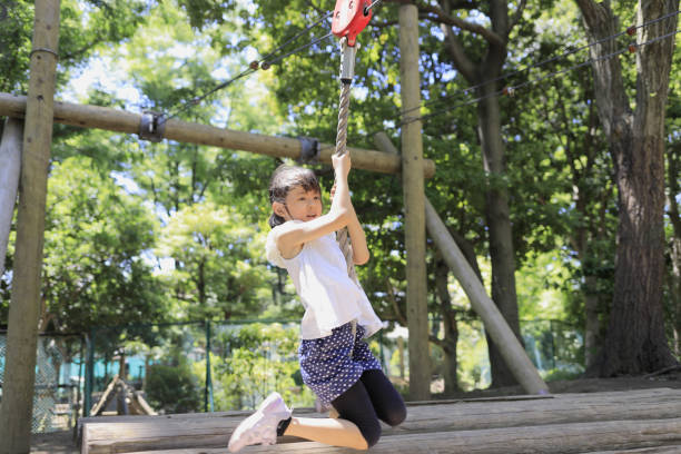 istock Japanese student girl playing with flying fox (7 years old) 1405133395