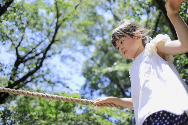 Japanese student girl playing with rope walking (7 years old)