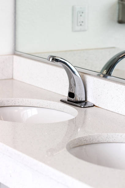 istock beautiful silver sink fixture in public restroom 1405137417