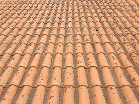 Close-up of red clay roof tiles as a background. concept wallpapers