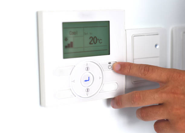 istock A hand switching on an air conditioner 1405143531