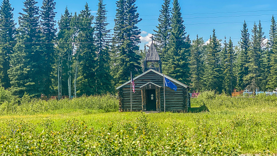 A church from days gone by stands as a reminder of days gone by. This church reminds one of the Hope. It stands as a symbol of strength and faith. This now abandoned church was once a place of worship for the people of Interior Alaska.