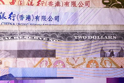 Gold bars on Chinese yuan bill banknotes background. Concept of China gold reserves, gold future commodity trading, gold ETF or buy gold bars for investment in China. Monetary gold is foreign exchange reserves or forex reserves.