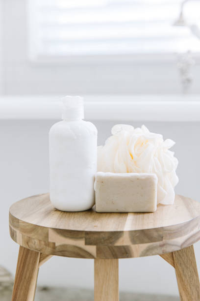 istock Body cleaning items on a stool by a bath tub 1405149333
