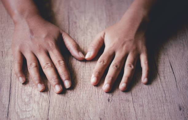 istock Asian woman's hand. Dark tone image, copy space. 1405151015