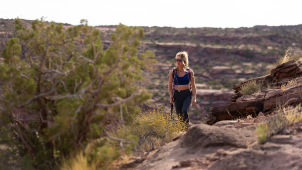 Hiker woman with backpack in the Utah desert