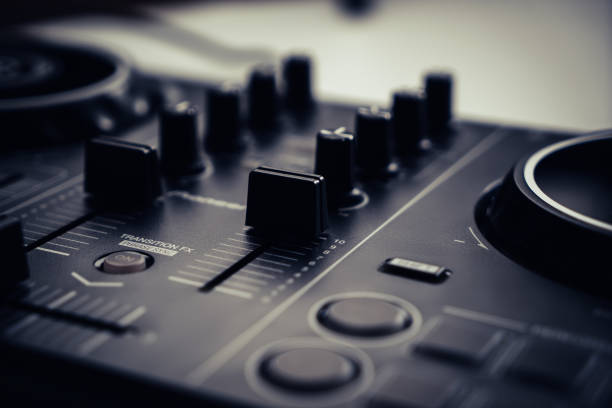 istock Digital DJ mixing deck Controller closed up on the fader and knob part. 1405154826