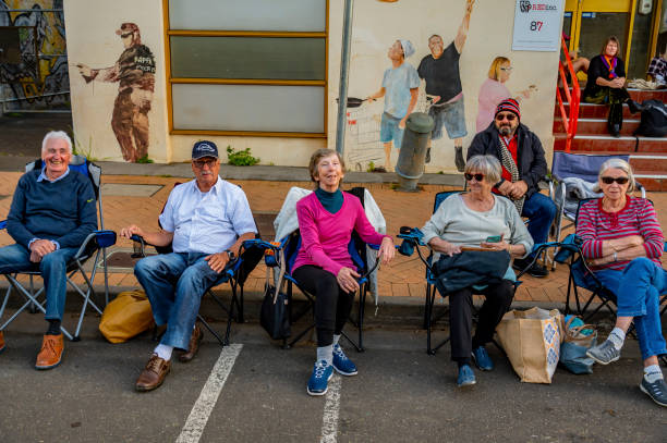 Lismore, NSW. Australia-June 25, 2022. The Lismore lantern parade. This is a yearly, free community event. It is most important this year as the city has been devastated by floods and this is a rare chance to celebrate hope and survival.People watching people marching in free parade.