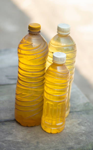 istock three oil bottles on a table on the road side and the background blur 1405163389