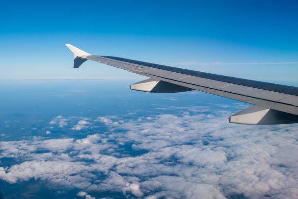 istock Cloudy view sky airplane, view from airplane window 1405167534