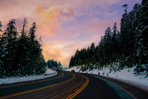 istock White Snow road trees drive, Road to wintry sunset 1405171556