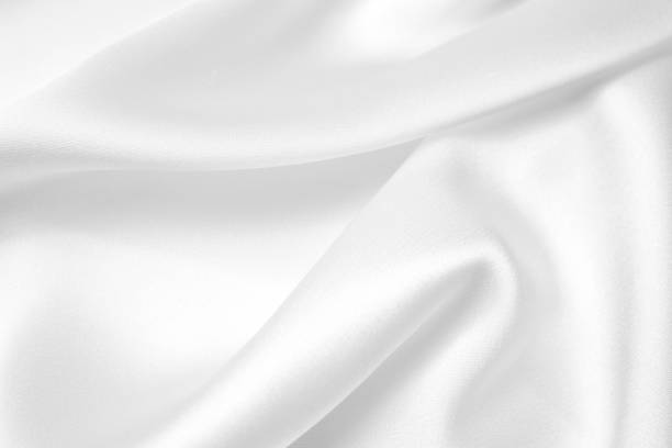 istock Smooth elegant white silk or satin luxury cloth texture can use as wedding background. Luxurious Christmas background or New Year background design 1405171572