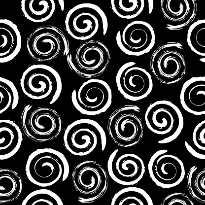 Abstract geometric pattern of small spirals on black background. Vector image.