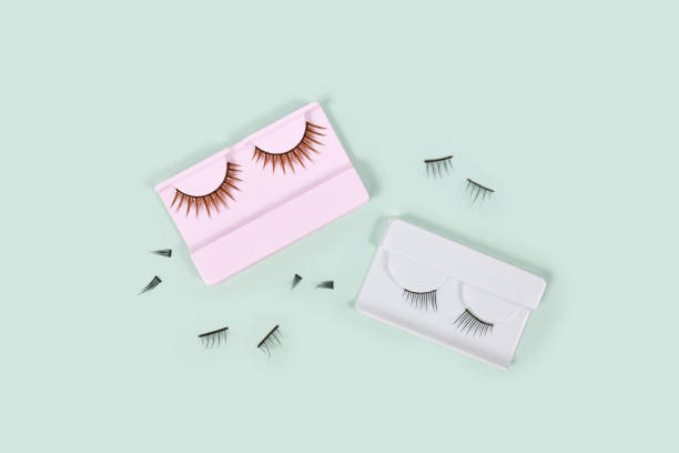Different false lashes Different false lashes on mint green background clump eyelashes stock pictures, royalty-free photos & images