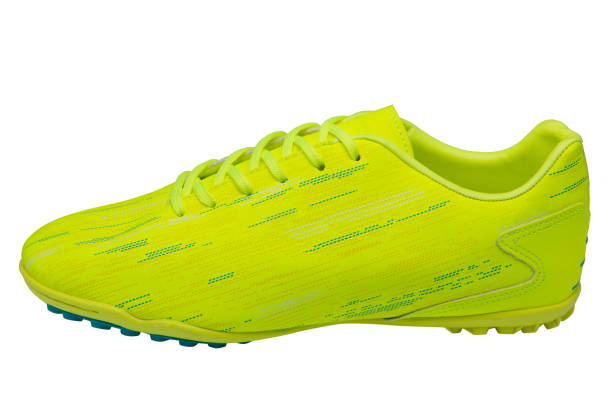 istock Lemon-colored soccer shoes, soles with rubber, on a white background 1405175249