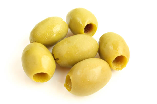 istock Group of wet olives without seed core isolated on white background 1405175750