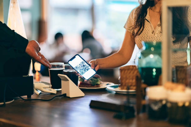istock Customer using contactless payment in a coffee shop 1405177507