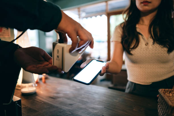 istock Customer using contactless payment in a coffee shop 1405177520