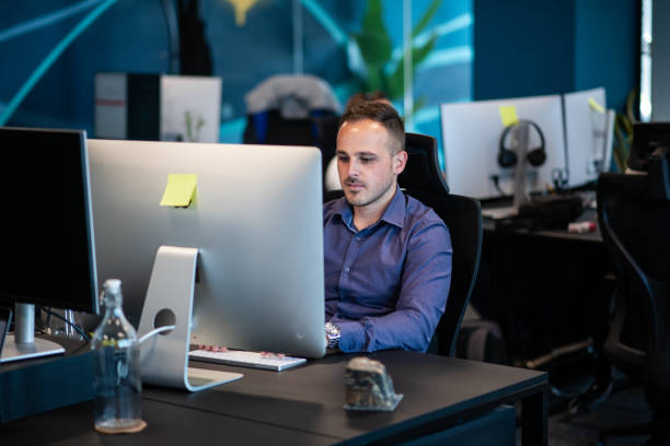 istock Young IT expert working in his new and modern joint office 1405182908