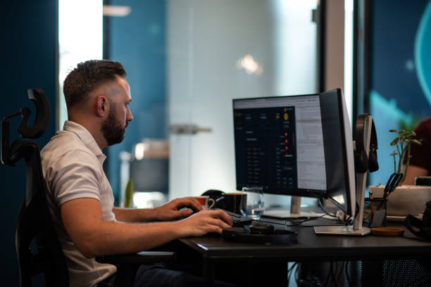 istock Young man working in a new and modern office 1405184135
