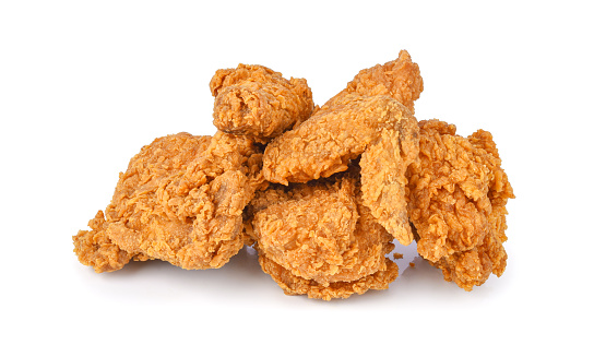 Heap of fried chicken isolated on white background.