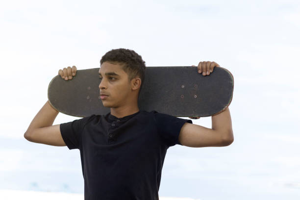 istock Latino boy posing with a skateboard. 1405191097