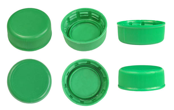 istock Set of plastic green bottle caps isolated on white background 1405191199