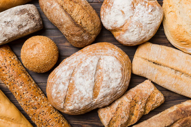 istock Homemade natural breads. Different kinds of fresh bread as background, top view with copy space 1405193782