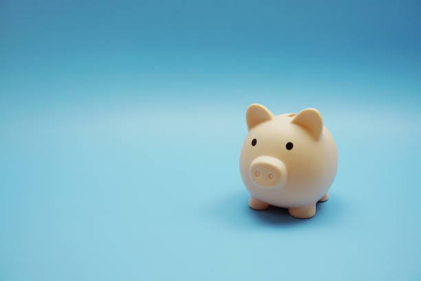 istock Piggy bank with space copy on blue background 1405197882