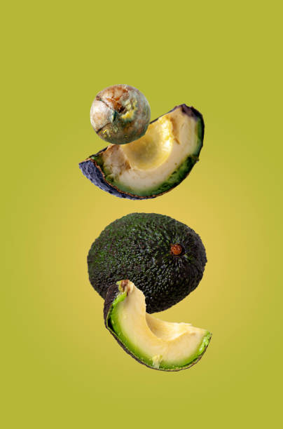 istock avocado slices fly on a green background 1405198409