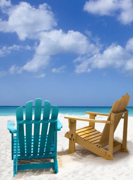 istock Two wooden beach chairs on Caribbean coast 1405198447