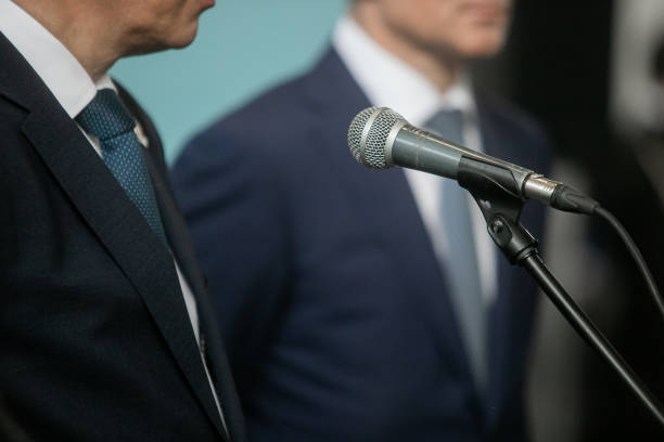 istock Businesswoman standing on stage and reporting for audience 1405199842