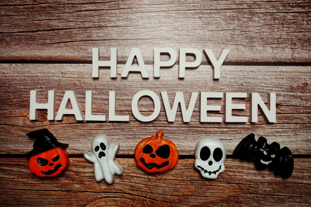 istock Happy Halloween alphabet letter on wooden background 1405201237