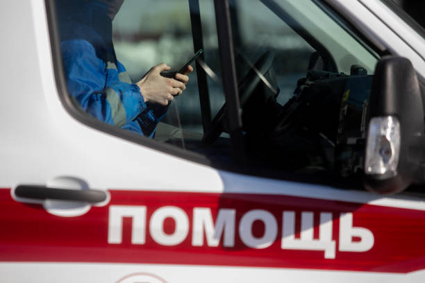 Inscription in Russian (Ambulance) on the car stock photo
