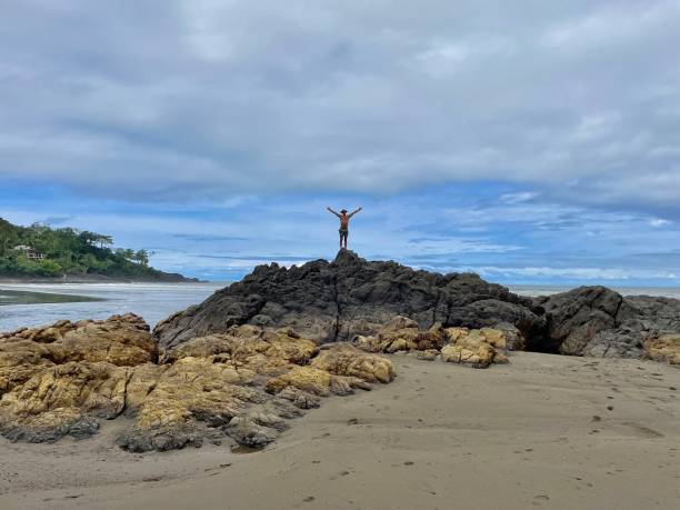 istock Standing on the Rocks- Celebrating Life 1405207298