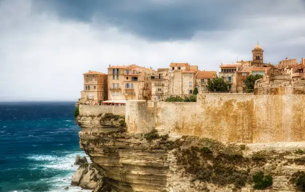 The dramatic cliff with the Old City of Bonifacio on the Southern tip of Corsica, France